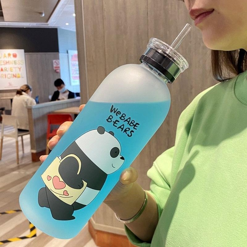 7989229d1ddaa578cc0360141f18c70c We Bear Panda Water Bottle 1000ml With Two Caps And Straw Durable Design For Daily Hydration And Easy Use (Random Design) - Image 1